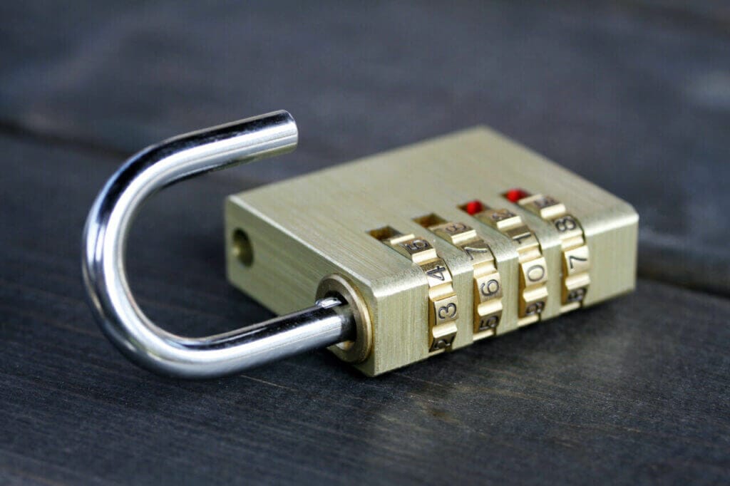 An opened combination lock lying on a surface