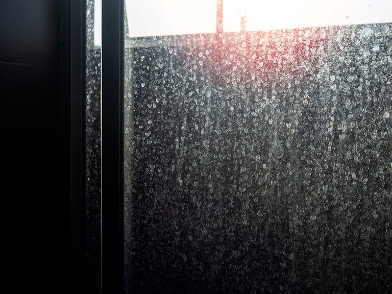 Close-up of a foggy glass of a sliding door