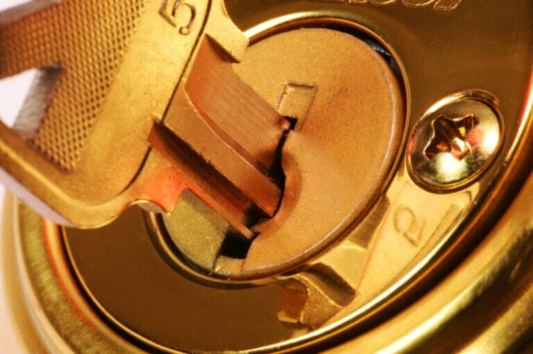 Close Up Of A Key Being Rotated In A Lock