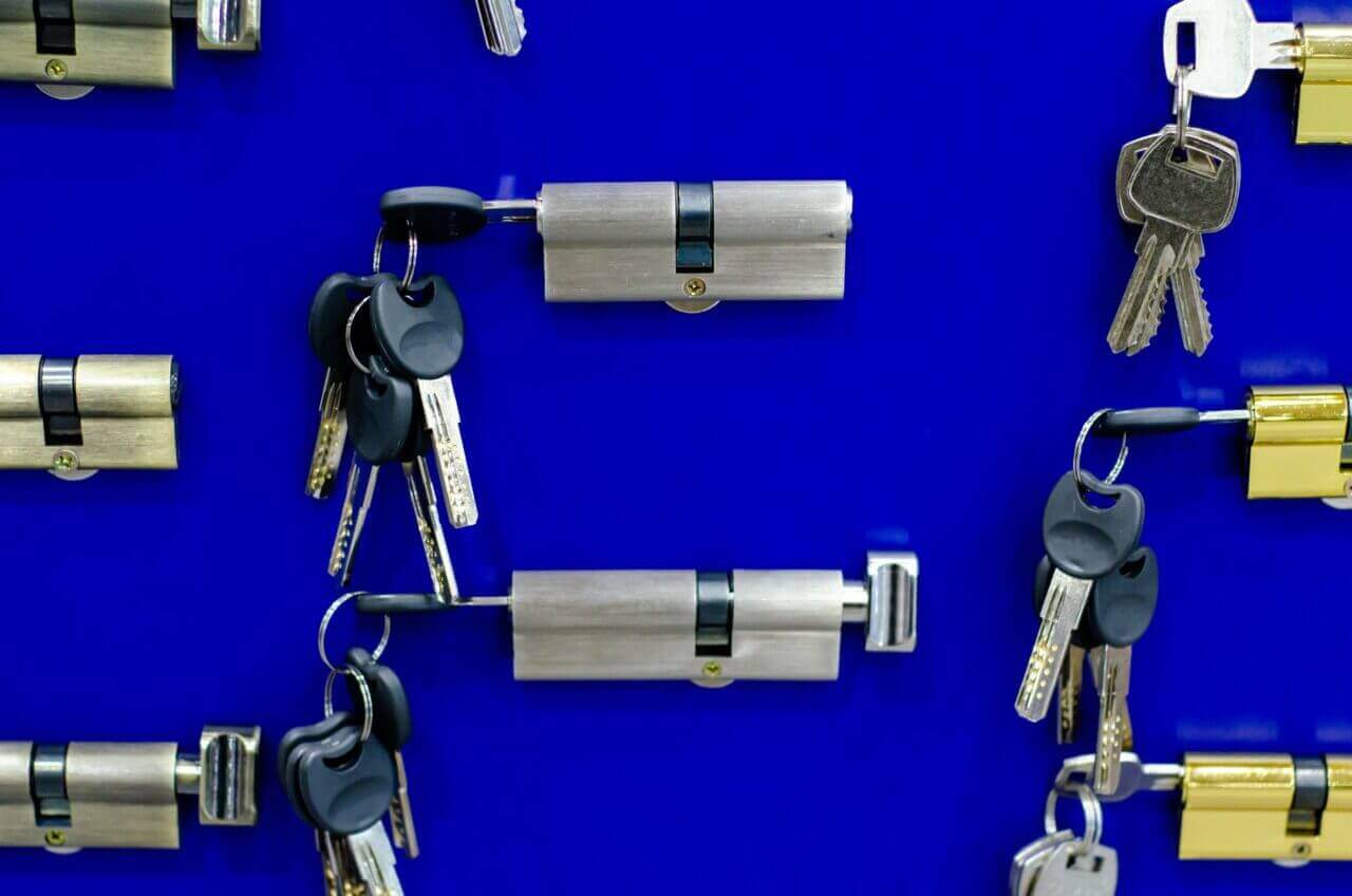 Door Locks And Keys On Blue Background