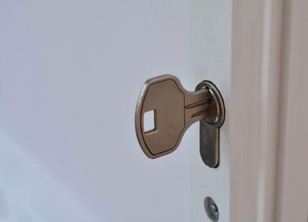 Key Inserted In Door Keyhole