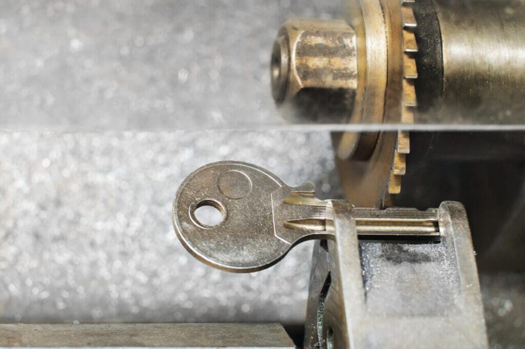 Close Up Of A Key Placed On The Vice Of A Key Duplicator Machine