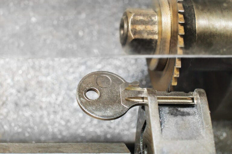 Close Up Of A Key Placed On The Vice Of A Key Duplicator Machine